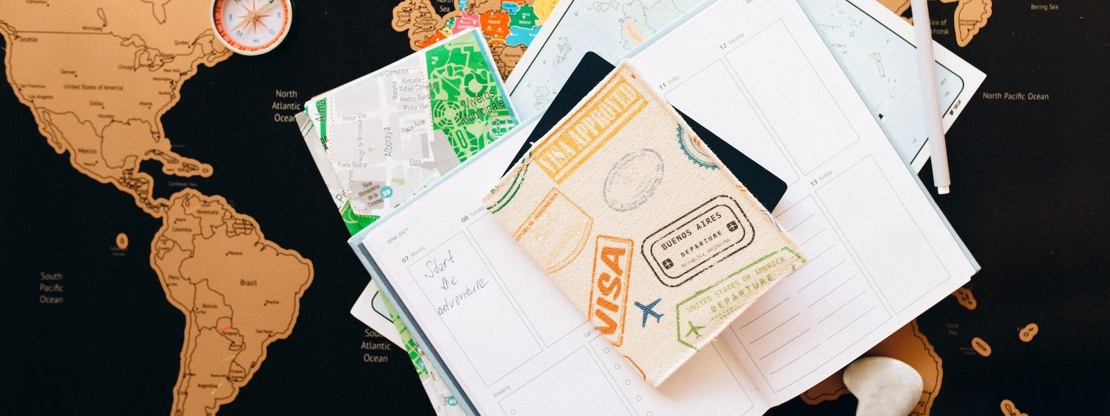Passport on Top of a Planner