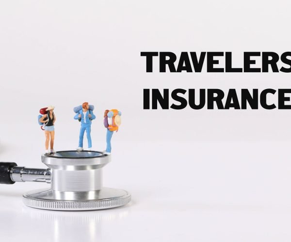 Miniature travelers with stethoscope and Travel Insurance text
