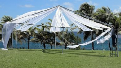 white canopy tent on green grass field during daytime