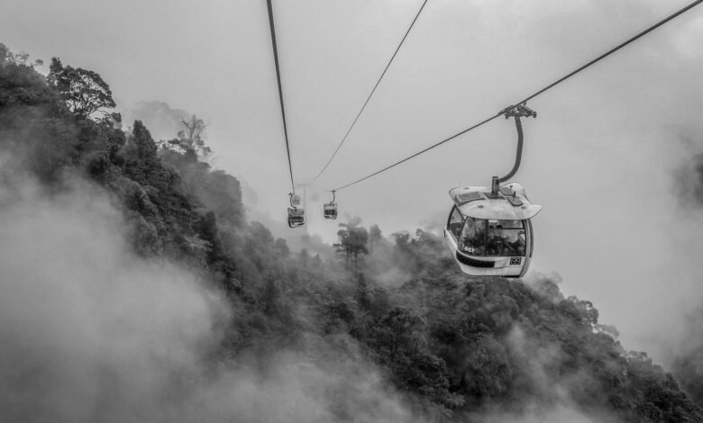 Grayscale Photo of Cable Cars