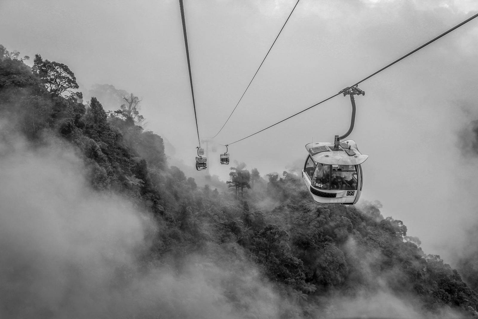 Grayscale Photo of Cable Cars