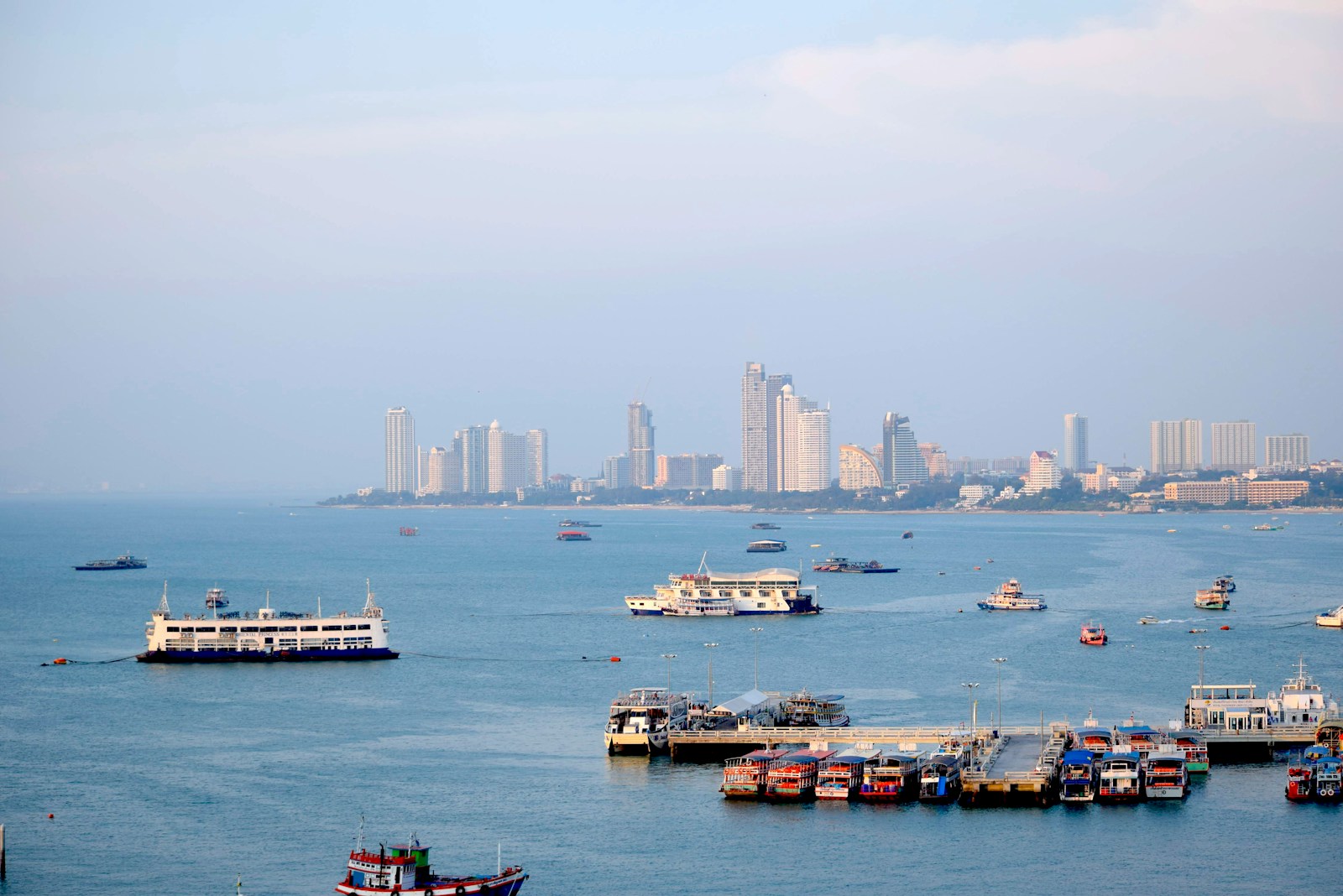 a group of boats floating on top of a large body of water