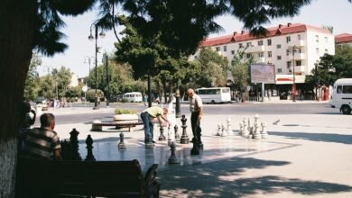 a group of people playing a game of chess