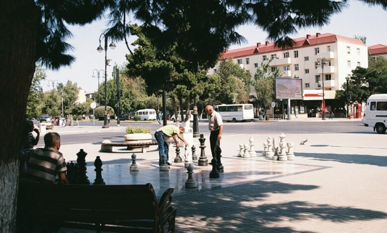 a group of people playing a game of chess