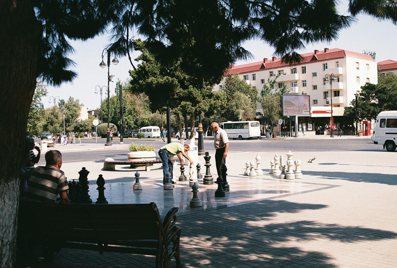a group of people playing a game of chess