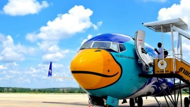 an airplane with a smiley face painted on the side