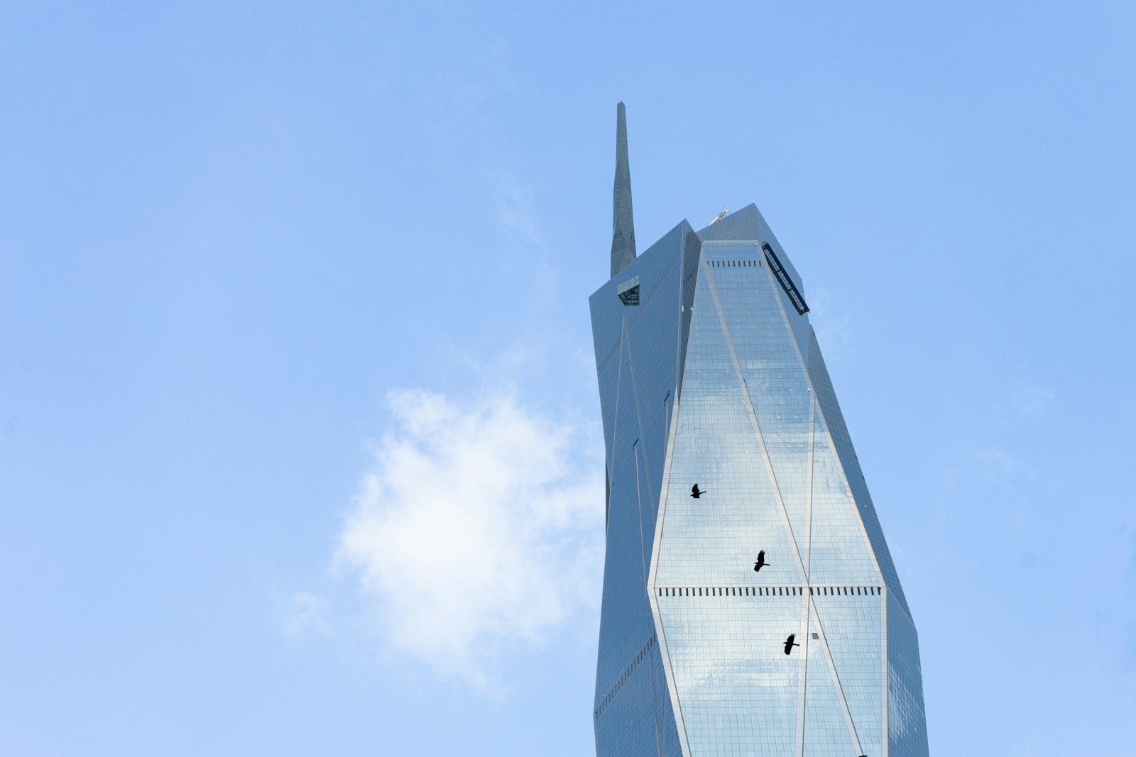 a very tall building with a sky background