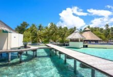 Explore tropical paradise with stunning overwater bungalows and crystal-clear waters in the Maldives.