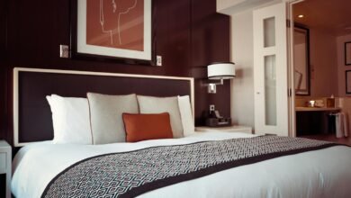 Cozy and modern hotel bedroom interior with elegant decor and soft lighting.