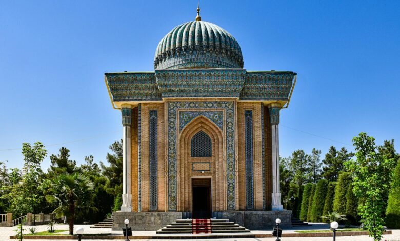 Mausoleum of Imam al-Matrudiy in Samarkand, showcasing architectural brilliance under a clear blue sky.