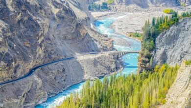 aerial photography of river surrounded by mountains