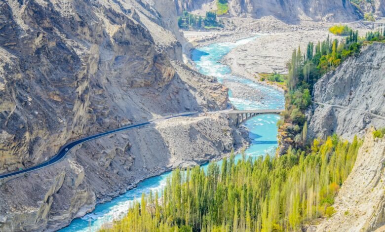 aerial photography of river surrounded by mountains