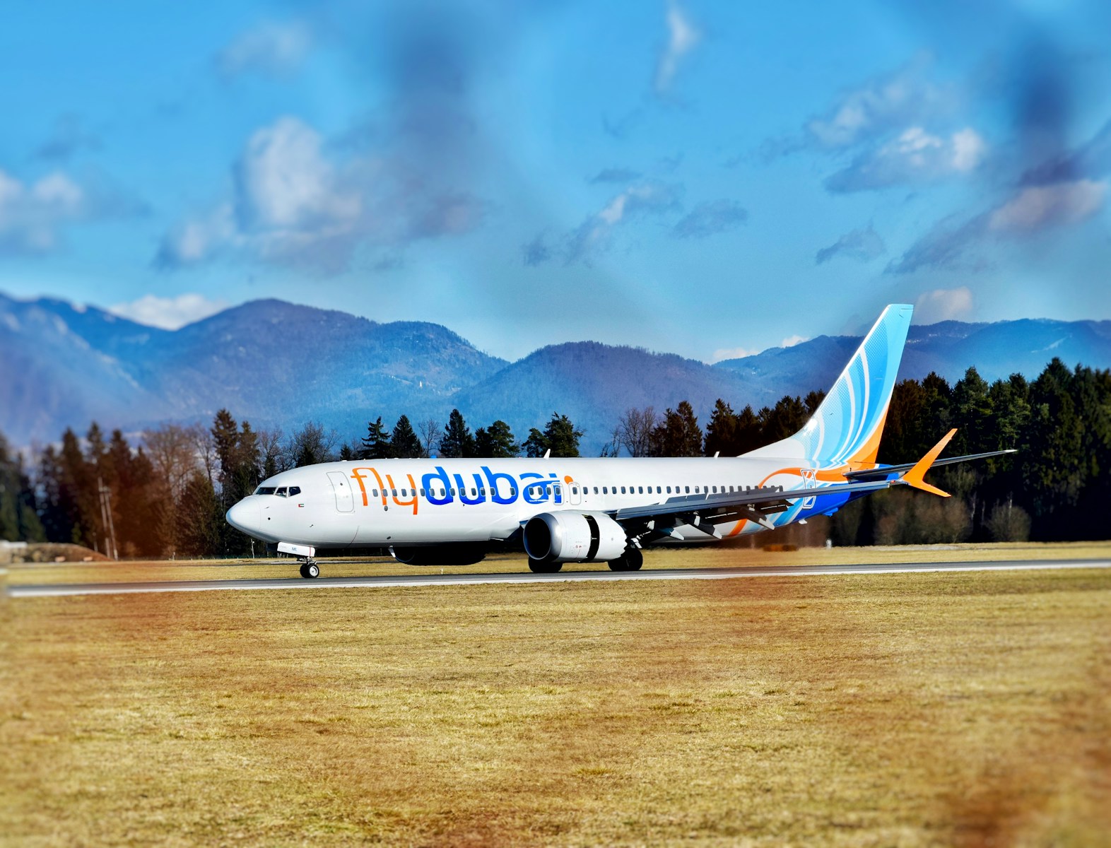 a large jetliner sitting on top of an airport runway