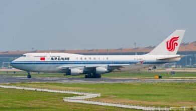 A large jetliner sitting on top of an airport runway