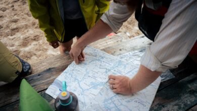 A group of people standing around a map