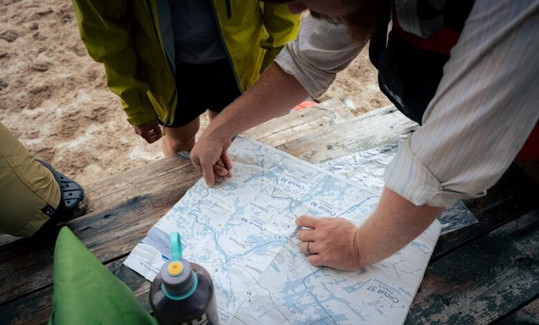 A group of people standing around a map