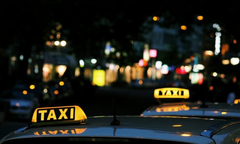 shallow focus photography of Taxi signage