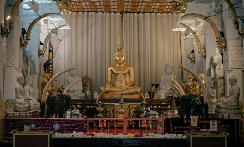 a golden buddha statue sitting in a room