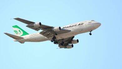 a large airplane flies through the air