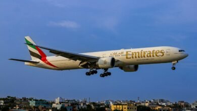 A large jetliner flying through a blue sky