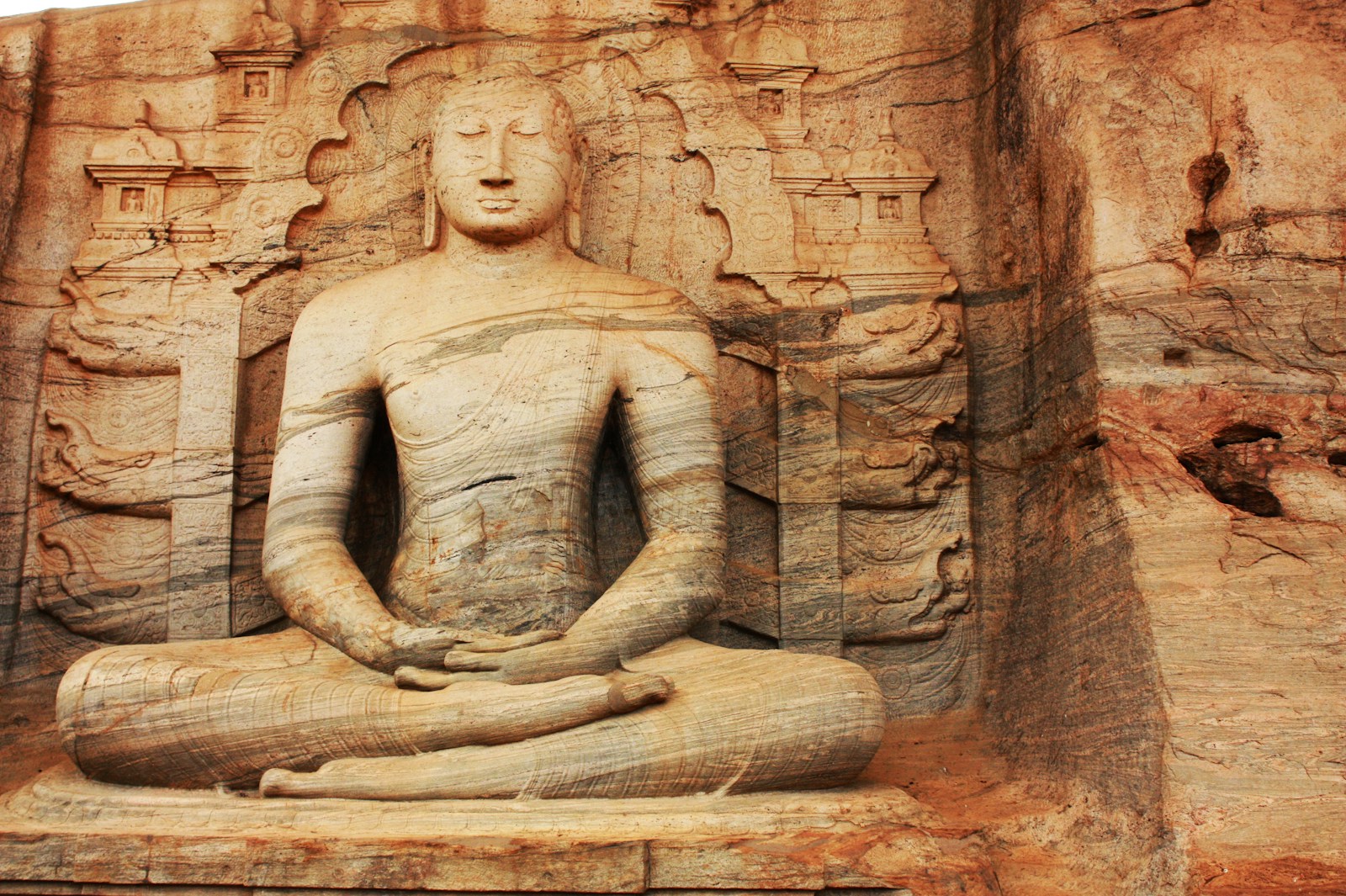 brown concrete statue of a woman