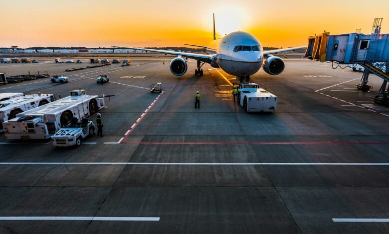 gray airplane on parking