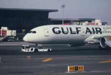 A large jetliner sitting on top of an airport tarmac