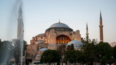 a large building with a dome and towers with Hagia Sophia in the background