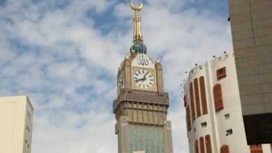 A tall clock tower towering over a city