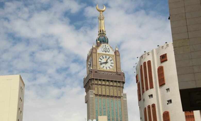 A tall clock tower towering over a city