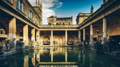 a large building with a pool in the middle of it