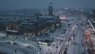 aerial photography of street at night covered with snow