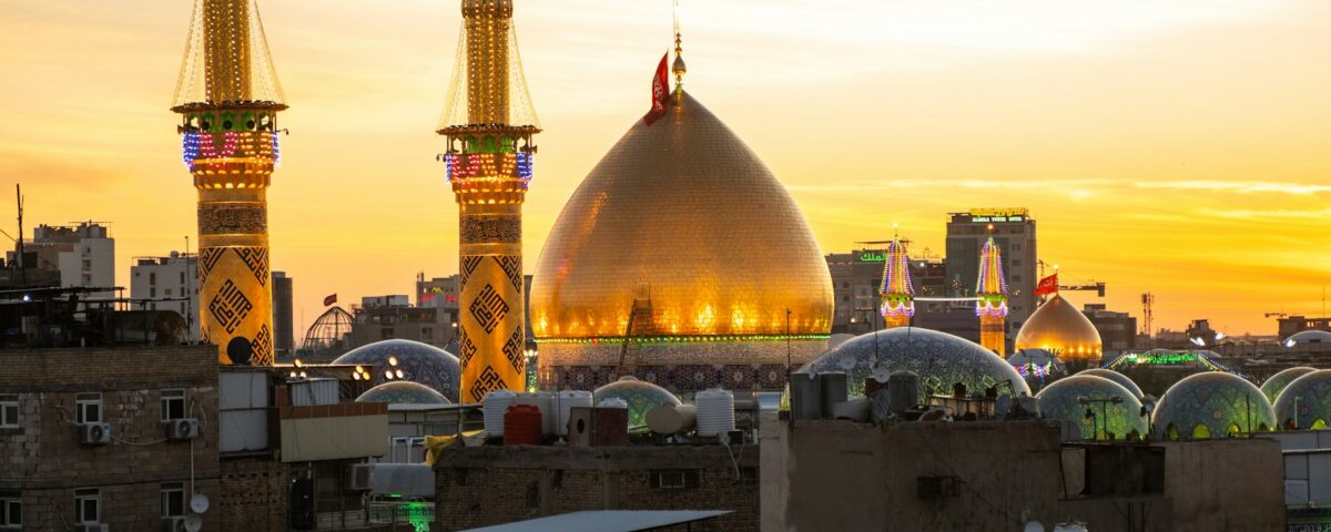 A sunset view of a city with tall buildings