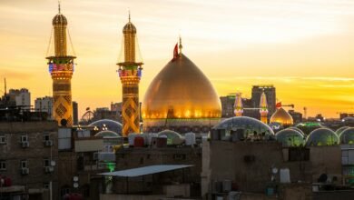 A sunset view of a city with tall buildings