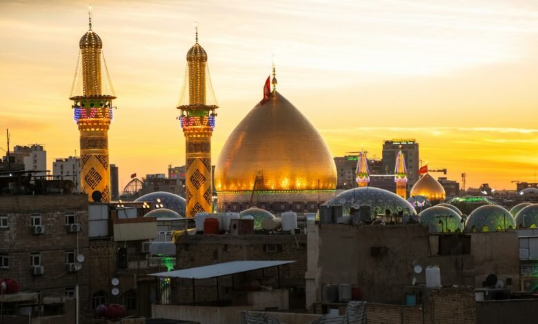 A sunset view of a city with tall buildings