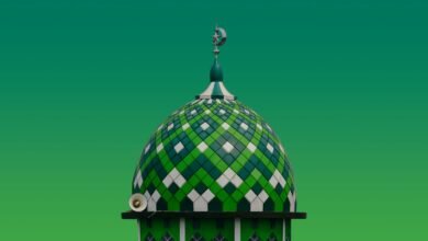 A green and white building with a clock on top