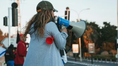 a woman drinking from a bottle